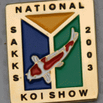 SAKKS NATIONAL Show pin 2003. Exhibitors (yellow triangle at top)